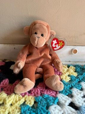 Ty Retired Bongo the Monkey Beanie Baby with original Tags and ERRORS